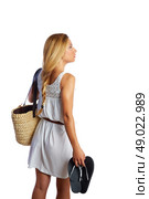 Blond tourist girl with flip flop shoes white summer dress and basket bag going beach rear view. Стоковое фото, агентство Ingram Publishing / Фотобанк Лори