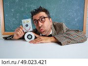 Nerd electronics technician with self made robot silly retro teacher. Стоковое фото, агентство Ingram Publishing / Фотобанк Лори