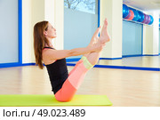 Pilates woman open leg rocker exercise workout at gym indoor. Стоковое фото, агентство Ingram Publishing / Фотобанк Лори