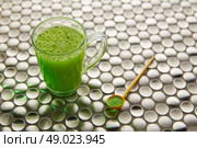 Matcha green tea from Japan on modern stainless steel background. Стоковое фото, агентство Ingram Publishing / Фотобанк Лори