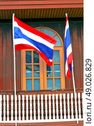 temple   in  bangkok thailand incision red venetian blind and terrace waving flag . Стоковое фото, агентство Ingram Publishing / Фотобанк Лори