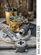 Set of old tools of the keys,screws and drills. Стоковое фото, агентство Ingram Publishing / Фотобанк Лори