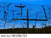 Stick pilgrims cross symbols in The Way of Saint James at La Rioja Logrono. Стоковое фото, агентство Ingram Publishing / Фотобанк Лори