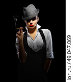 Young woman in manly style with cigar isolated. Стоковое фото, агентство Ingram Publishing / Фотобанк Лори