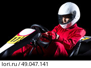 Young woman karting racer isolated. Стоковое фото, агентство Ingram Publishing / Фотобанк Лори