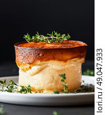 Savory Cheese Souffl Garnished With Fresh Thyme on White Plate in a Dark Setting. Стоковое AI-изображение, AI-художник Юлия Гапеенко / Фотобанк Лори