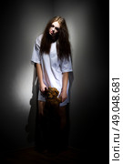 Zombie girl with teddy bear on black. Стоковое фото, агентство Ingram Publishing / Фотобанк Лори