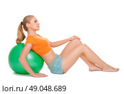 Young sporty woman with gymnastic ball. Стоковое фото, агентство Ingram Publishing / Фотобанк Лори