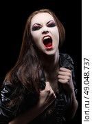 Young beautiful vampire woman isolated. Стоковое фото, агентство Ingram Publishing / Фотобанк Лори