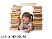 Little smiling girl with books isolated. Стоковое фото, агентство Ingram Publishing / Фотобанк Лори