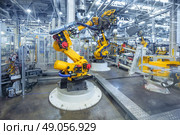 robotic arms in a car plant. robots in a car plant. Стоковое фото, агентство Ingram Publishing / Фотобанк Лори