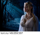 Young elven girl in night forest. Стоковое фото, агентство Ingram Publishing / Фотобанк Лори