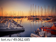 Marina with docked yachts at sunset in Giulianova, Italy. Стоковое фото, агентство Ingram Publishing / Фотобанк Лори