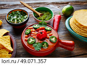 Frijoles charros mexican beans with chili pepper sides and tortillas. Стоковое фото, агентство Ingram Publishing / Фотобанк Лори