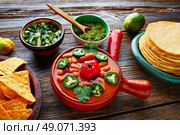 Frijoles charros mexican beans with chili pepper sides and tortillas. Стоковое фото, агентство Ingram Publishing / Фотобанк Лори