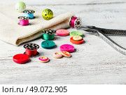 Beads,thread and bobbins for needlework.Picture in light key. Стоковое фото, агентство Ingram Publishing / Фотобанк Лори