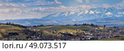 Malopolska Panorama with snowy Tatra mountains in spring. Стоковое фото, агентство Ingram Publishing / Фотобанк Лори