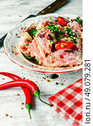 Plate of fresh meat in the marinade and hot spices.. Marinated veal with spices. Стоковое фото, агентство Ingram Publishing / Фотобанк Лори