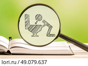 Illness analysis with a pencil drawing of a sick person in a magnifying glass. Стоковое фото, агентство Ingram Publishing / Фотобанк Лори