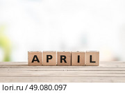 April sign with wooden cubes in the spring. Стоковое фото, агентство Ingram Publishing / Фотобанк Лори