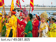 Vietnamese women in colorful Cham costumes near Po Nagar Towers in Nha Trang at a celebration. NHA Trang, Vietnam - April 17th, 2025. Редакционное фото, фотограф Корчагина Анастасия / Фотобанк Лори