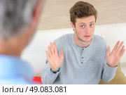 young man defending himself. Стоковое фото, агентство Ingram Publishing / Фотобанк Лори
