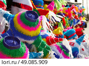 Mexican party pinatas decorated with fringed tissue colorful paper. Стоковое фото, агентство Ingram Publishing / Фотобанк Лори