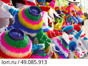 Mexican party pinatas decorated with fringed tissue colorful paper. Стоковое фото, агентство Ingram Publishing / Фотобанк Лори
