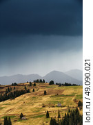 Spring rain in mountains. Thunder and clouds. Стоковое фото, агентство Ingram Publishing / Фотобанк Лори