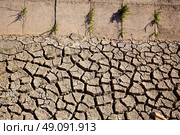 Dried irrigation ditch clay soil in Albufera rice fields of Valencia. Стоковое фото, агентство Ingram Publishing / Фотобанк Лори