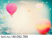 Colorful hot air balloons on beautiful sky background, retro toned. Стоковое фото, агентство Ingram Publishing / Фотобанк Лори