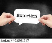 Extortion written on a speechbubble. Стоковое фото, агентство Ingram Publishing / Фотобанк Лори