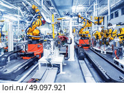 robots in a car factory. robotic arms in a car plant. Стоковое фото, агентство Ingram Publishing / Фотобанк Лори
