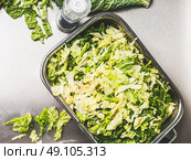 Chopped Savoy cabbage in metal bowl, preparation, top view. Healthy Eating and diet food concept. Стоковое фото, агентство Ingram Publishing / Фотобанк Лори