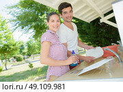 washing the dishes together. Стоковое фото, агентство Ingram Publishing / Фотобанк Лори