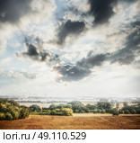 Country Landscape with plowed field, trees and beautiful sky with clouds and sunlight. Стоковое фото, агентство Ingram Publishing / Фотобанк Лори