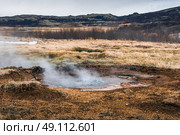 Boiling water in a puddle in icelandic nature. Стоковое фото, агентство Ingram Publishing / Фотобанк Лори