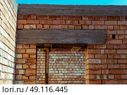 house under constraction with modern brick walls and holes for doors and windows. Стоковое фото, фотограф Feruza Tashmetova / Фотобанк Лори