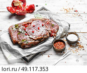 meat prepared for jerky. Beef seasoned in spicy spices and pomegranate juice. Стоковое фото, агентство Ingram Publishing / Фотобанк Лори