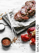 Meat knuckle ,soaked in pomegranate sauce and spices. Стоковое фото, агентство Ingram Publishing / Фотобанк Лори