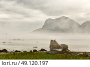 Summer cloudy Lofoten islands. Norway misty sea and fjords. Nordic rain. Стоковое фото, агентство Ingram Publishing / Фотобанк Лори