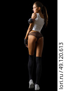 Fitness girl isolated on black. Стоковое фото, агентство Ingram Publishing / Фотобанк Лори