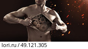 Human robot tearing up his thick chest skin. Стоковое фото, агентство Ingram Publishing / Фотобанк Лори
