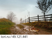 Muddy ground after rain in Carpathian mountains. Extreme path rural dirt road in the hills. Bad weather. Стоковое фото, агентство Ingram Publishing / Фотобанк Лори
