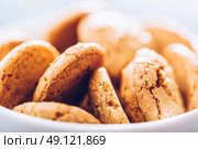Italian Amaretti Biscuits In White Bowl. Стоковое фото, агентство Ingram Publishing / Фотобанк Лори