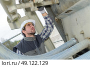 young engineer checking industrial site systems. Стоковое фото, агентство Ingram Publishing / Фотобанк Лори