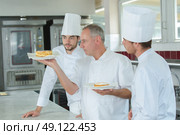 three best cooks doing their work. Стоковое фото, агентство Ingram Publishing / Фотобанк Лори