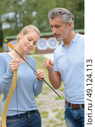 learning to put the arrow properly. Стоковое фото, агентство Ingram Publishing / Фотобанк Лори