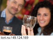 Couple with coffee and beans in glass cups. Стоковое фото, агентство Ingram Publishing / Фотобанк Лори