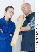 young woman working with a carpenter teacher. Стоковое фото, агентство Ingram Publishing / Фотобанк Лори